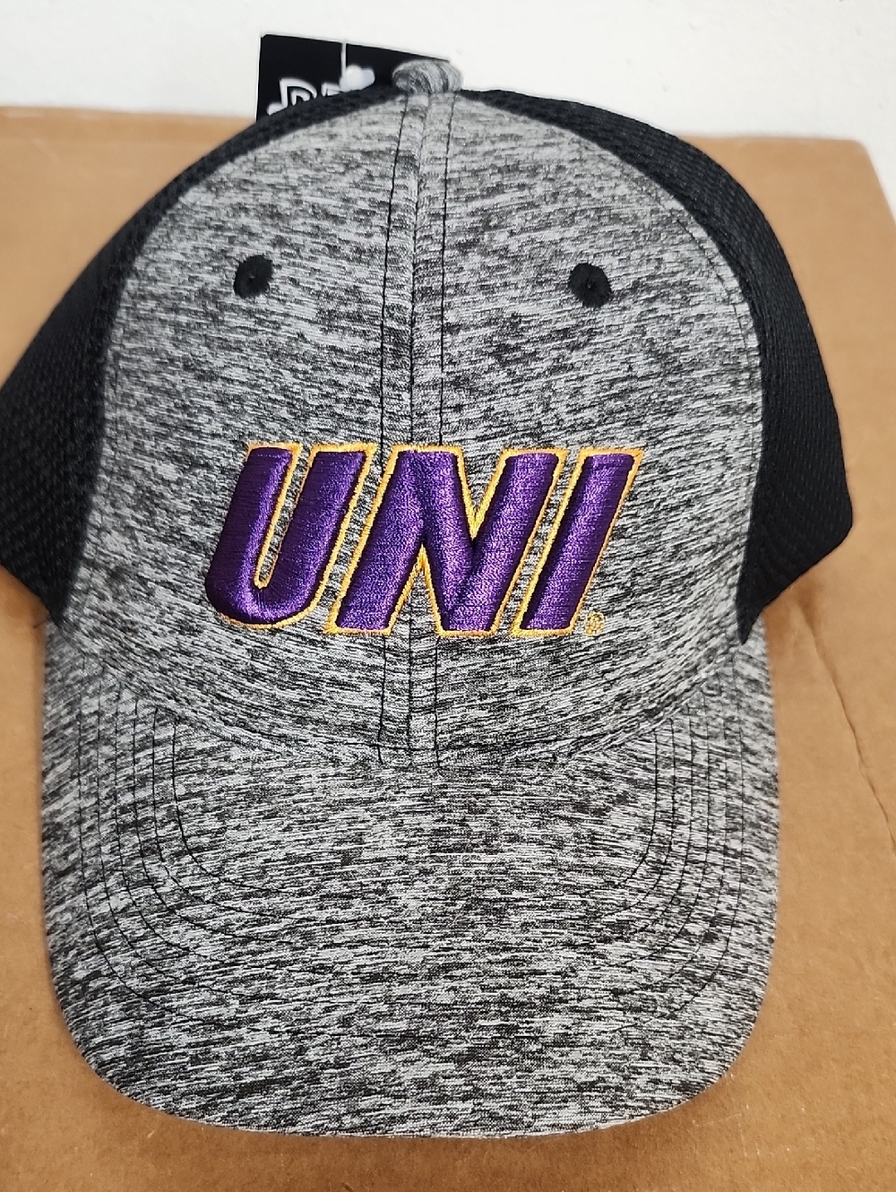 UNI Embroidered Heathered Trucker Hat in Gray & Black